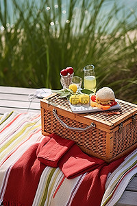 梳理典型背景图片_佛罗里达州南部的一次户外野餐，配有毛巾和木凳旁边的海滩梳理篮