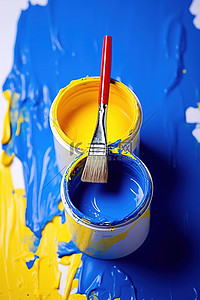 彩色油漆和油漆刷与画家的胶带
