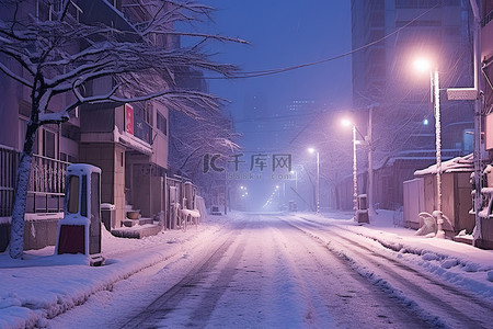 城市的冬天背景图片_夜晚城市中一条白雪覆盖的街道