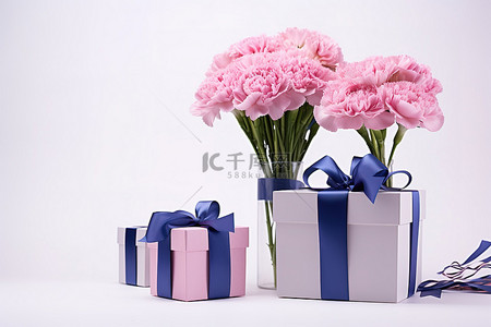 粉色教师节背景图片_康乃馨盒丝带和礼物