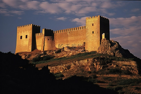 武术动作剪影背景图片_一座城堡坐落在岩石顶上
