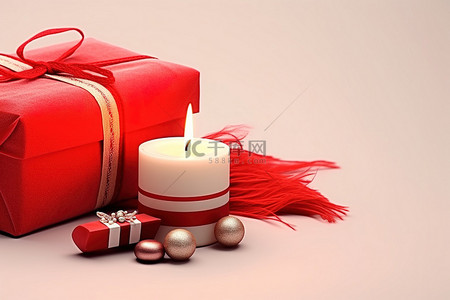 白色背景的红色礼品盒和带有柔软织物的蜡烛