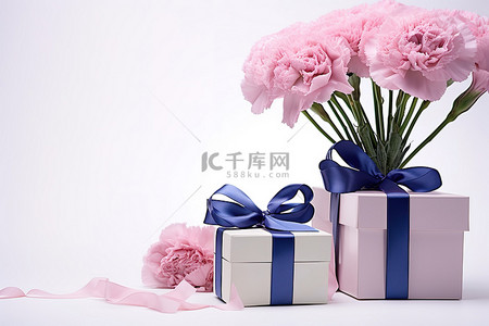 粉色教师节背景图片_康乃馨盒丝带和礼物