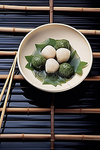 筷子背景图片_一碗小圆煎饺和一根亚洲筷子