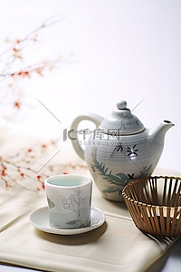 特产清酒背景图片_茶壶盘子风扇和其他物品放在白色表面上