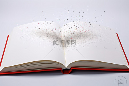 一本打开的书，上面有银色衬里和灰尘点