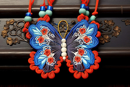 蓝色地区选择框背景图片_蓝色和红色分层刺绣的东方中国蝴蝶