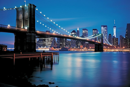 美国大桥背景图片_傍晚灯光下的布鲁克林大桥