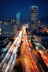 高楼夜景背景图片_一座高楼林立夜间交通拥堵的城市