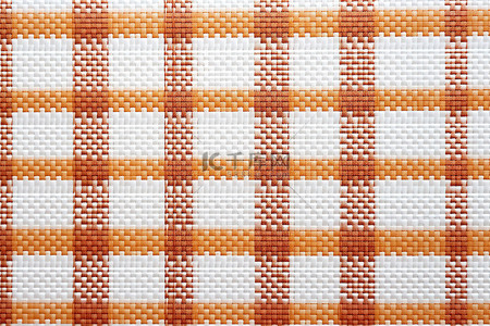 条纹的背景图片_带有白色和橙色条纹的织物的照片