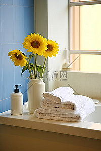 毛巾花背景图片_浴室梳妆台水槽一侧的鲜花和毛巾