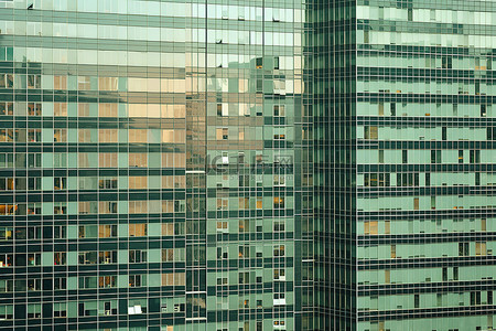 一群人踢足球背景图片_一群高高的摩天大楼组成了一座大型办公楼