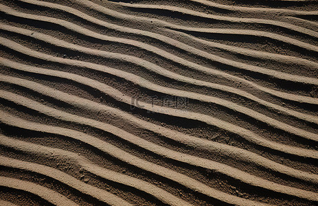 沙子堆背景图片_一堆沙子有很多线条的图片