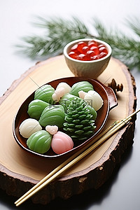 筷子背景图片_甜点和糖果用筷子和松果