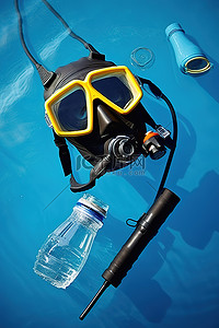 潜水装备背景图片_蓝色水中的潜水装备