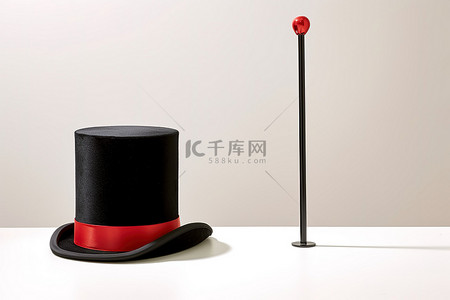 魔术师的高​​帽和高帽旁边的魔杖
