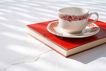 瓷砖上的杯子和一本书 photo