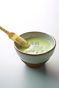 抹茶背景图片_一碗抹茶绿茶，上面有一个勺子