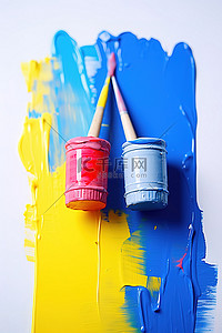 彩色油漆和油漆刷与画家的胶带