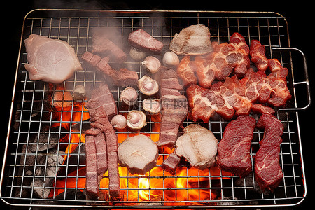 燒烤架背景图片_一个开放式的烤架，上面有很多肉