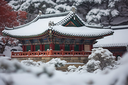 冬天古建筑背景图片_雪中​​的清溪川宝塔