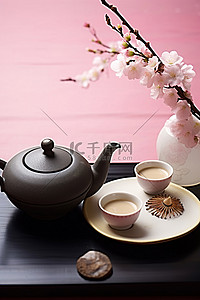 水墨画水墨画背景图片_粉红色盘子上的茶壶和花盆