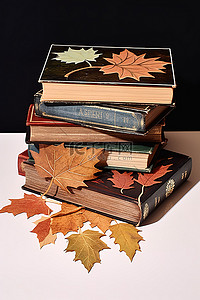 桌子上的书籍背景图片_桌子上放着一系列书籍，上面有叶子