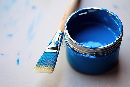 一把艾草背景图片_旁边桌子上放着一把涂有蓝色颜料的画笔