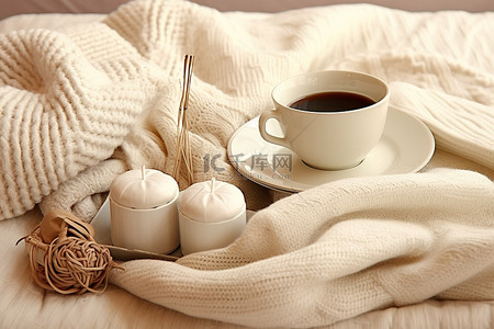 温暖毛衣背景图片_毛衣编织娃娃织针咖啡在温暖的床上用品