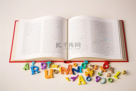 高定背景图片_一本打开的书和周围的彩色字母