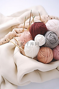 织毛衣的针背景图片_白色的毛衣针织羊毛和织针