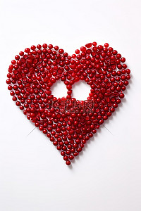 珠子背景图片_白色背景上由红色珠子制成的心