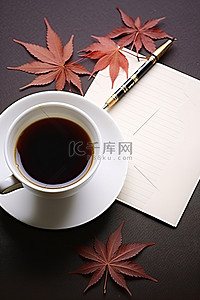桌上办公用品背景图片_桌上放着一杯咖啡笔和信封