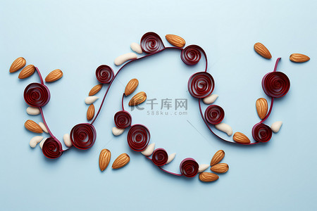 坚果拟人背景图片_杏仁和樱桃组成了“raise”这个词，形状为“up”