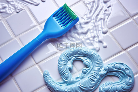 在背景图片_在瓷砖上刷牙膏和蓝色牙膏