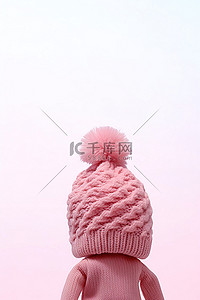 粉色的帽子背景图片_粉色毛线帽是用绒球编织而成的