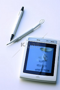 笔的背景图片_一个 ipod 和一个带笔的笔记本