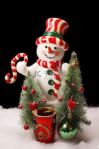 有圣诞树和拐杖糖的雪人