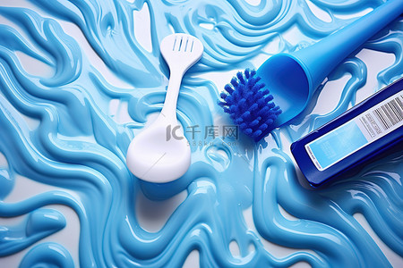 卫生用品背景图片_地板上的蓝色牙膏刷和牙刷