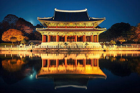 楼亭背景图片_夜晚河边一座优雅的韩国宫殿