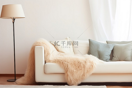 毯子背景图片_房间里的白色沙发和桌子