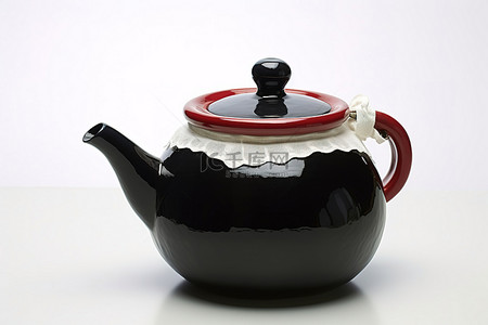 黑色茶壶是白色和红色的，有把手