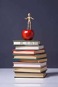 水果教育背景图片_一个木制人物站在一摞书的上面
