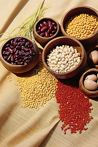 混合坚果背景图片_草巾上各种不同种类的谷物豆类种子和坚果