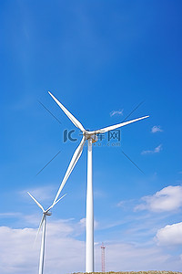 蓝风车背景图片_蓝天下的两台风力发电机