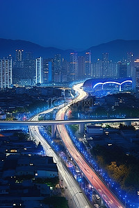 蓝色的灯光背景图片_城市道路和桥梁有蓝色的灯光