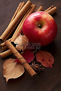 一个苹果，一根肉桂棒和一些叶子