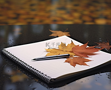笔的背景图片_一本带笔的笔记本放在一些叶子之前