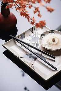 筷子背景图片_一个托盘放在两根筷子和风扇前面