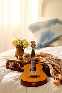 床上放着尤克里里吉他和毯子